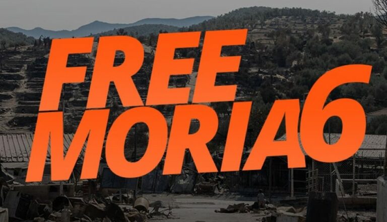 #FreeMoria6 logo in orange overlaying an image of Moria camp