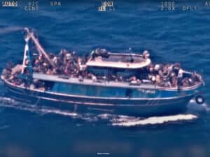 An aerial surveillance photograph of a distressed boat