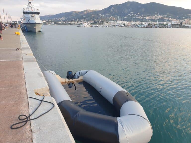 A shipwrecked dinghy docked in the port