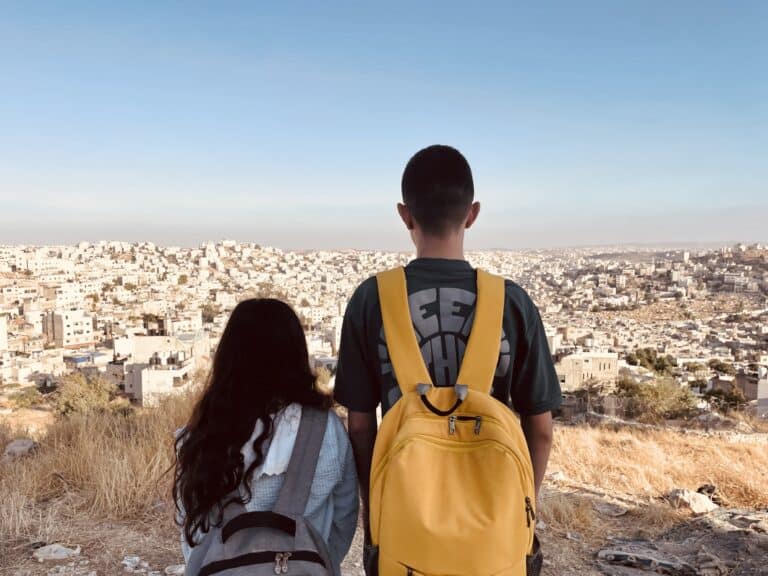 Two children look over a city scape