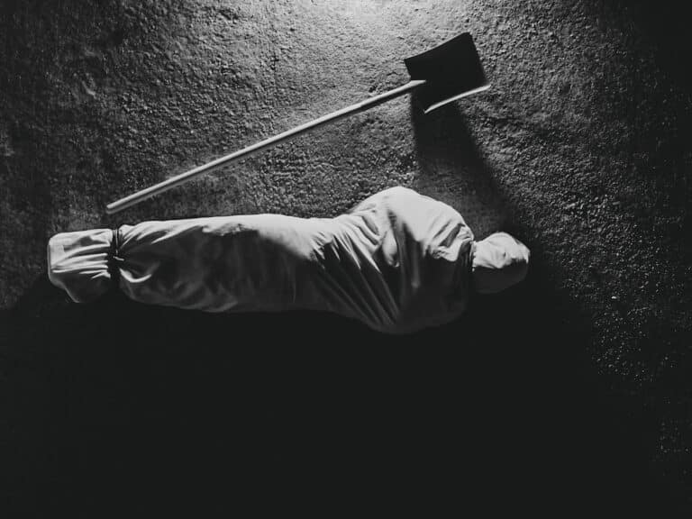 A person wrapped in a burial shroud