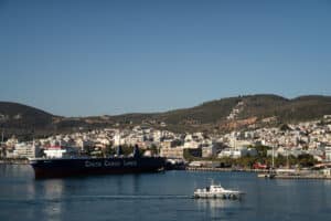 A naval boat arriving into harbour in mytilene, greece