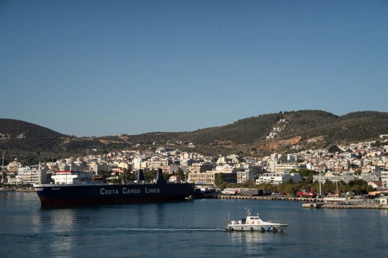 A naval boat arriving into harbour in mytilene, greece