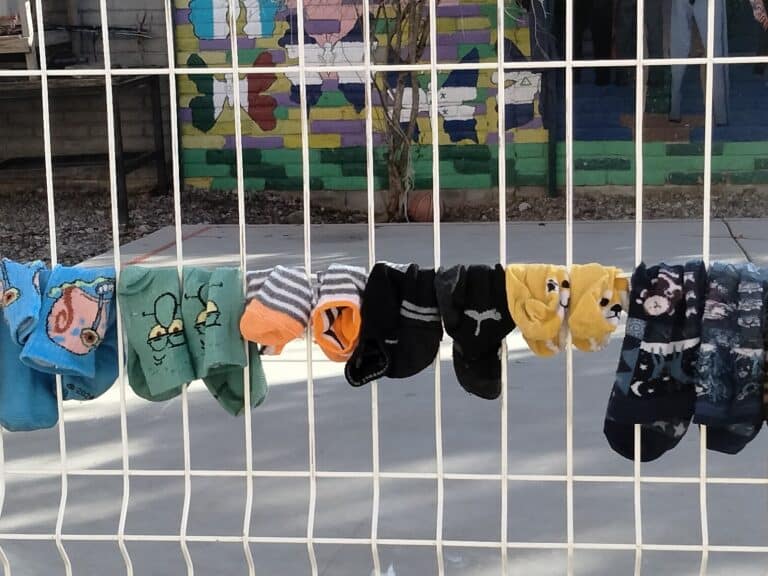 Socks hanging from a railing