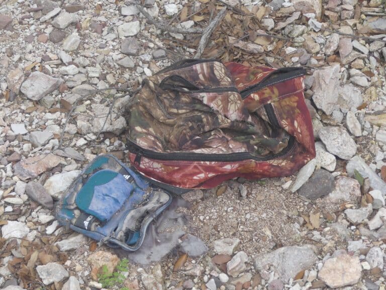 Abandoned bags on a migrant trail