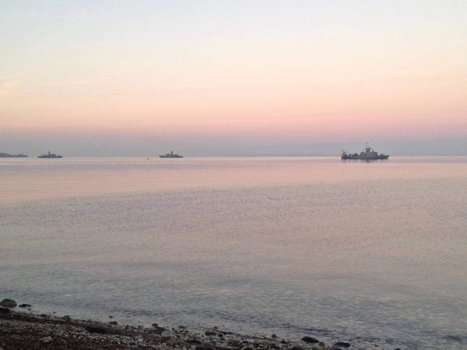 Coast Guard ships in the distance