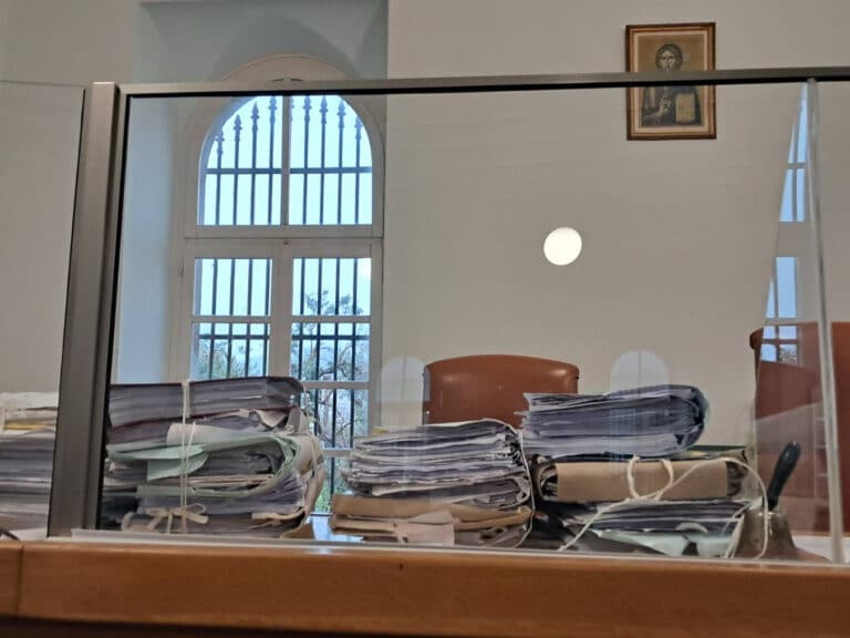 Files stacked on a judge's desk