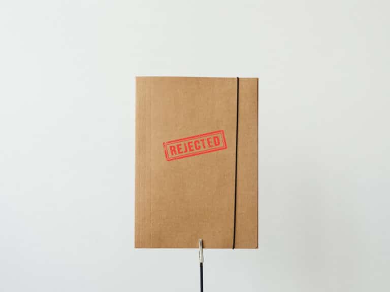 A file stamped with the word "rejected"
