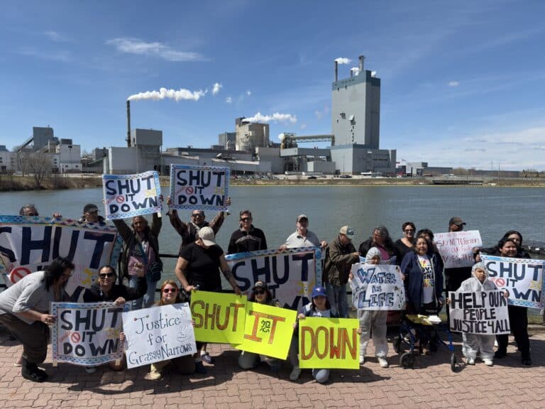 People at a protest against the Dryden Mill