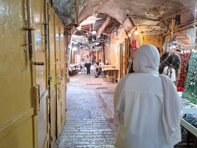 A woman walking through a marketplace