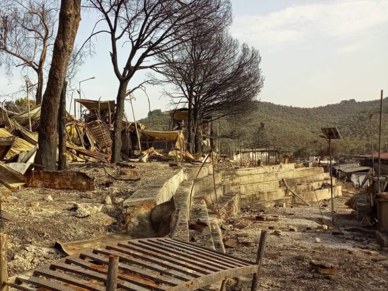 The aftermath of a fire in a refugee camp