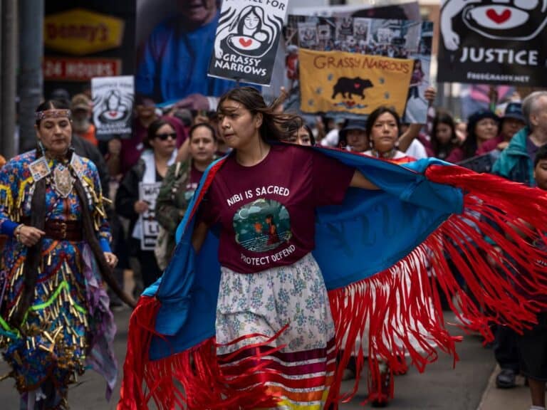 A woman leading a demonstration