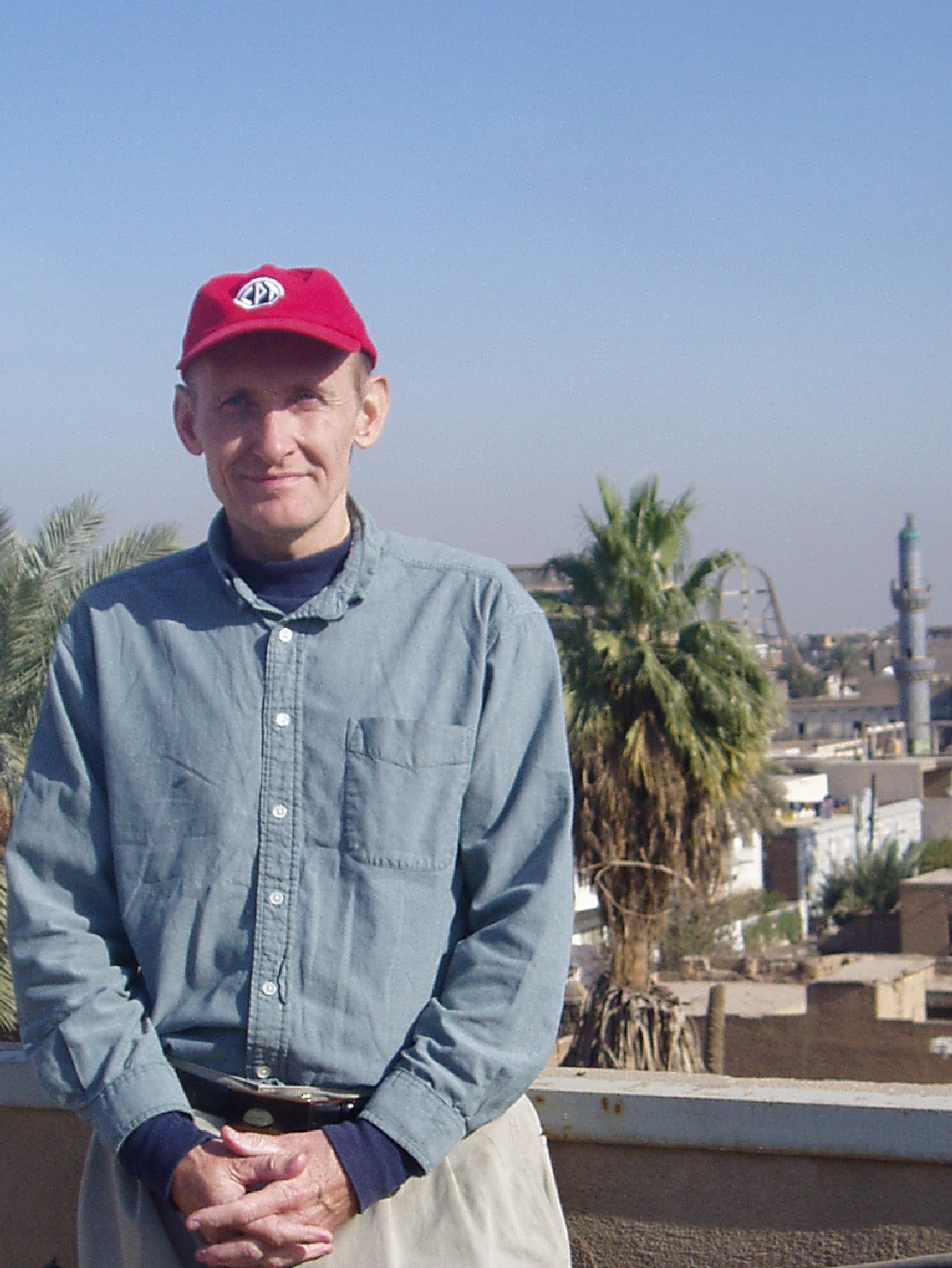 Man in red cap poses for a portrait